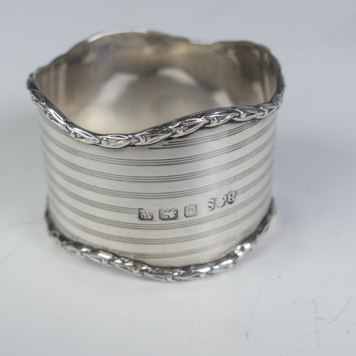 16 - A pair of George V silver Napkin Rings, hallmarked Birmingham 1923, with vacant laurel wreath cartou... 