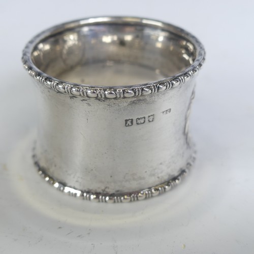 16 - A pair of George V silver Napkin Rings, hallmarked Birmingham 1923, with vacant laurel wreath cartou... 