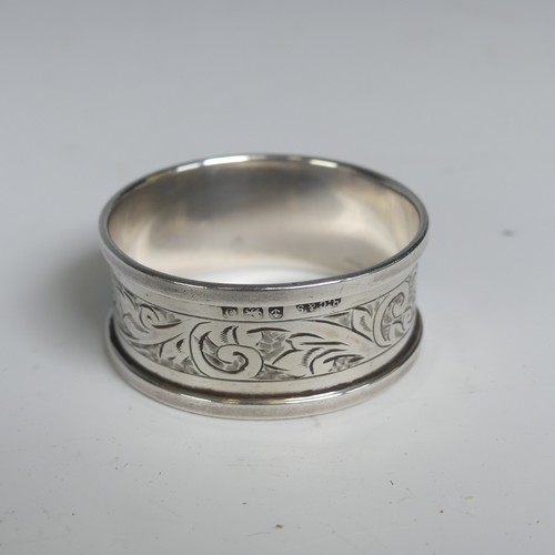 16 - A pair of George V silver Napkin Rings, hallmarked Birmingham 1923, with vacant laurel wreath cartou... 