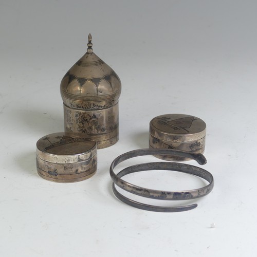 52 - A pair of Iraqi silver and niello circular Pots, one lift of cover with depiction of a sailing ... 