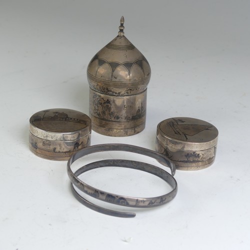 52 - A pair of Iraqi silver and niello circular Pots, one lift of cover with depiction of a sailing ... 