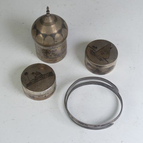 52 - A pair of Iraqi silver and niello circular Pots, one lift of cover with depiction of a sailing ... 