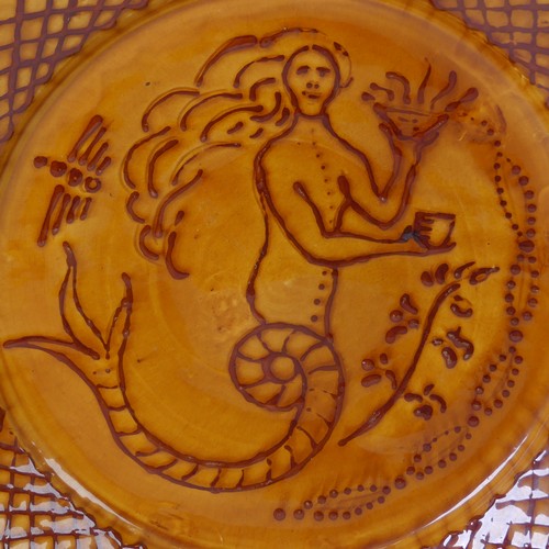 38 - William Fishley Holland (1888-1971) a Clevedon Pottery Charger, decorated in slip with a mermaid wit... 