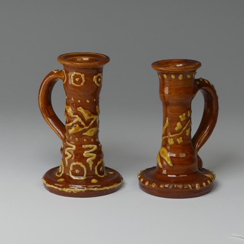 9 - Edwin Beer Fishley (1832-1912) two Fremington Pottery Candlesticks, in Wrotham style with brown grou... 