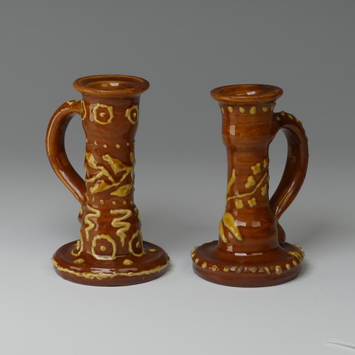 9 - Edwin Beer Fishley (1832-1912) two Fremington Pottery Candlesticks, in Wrotham style with brown grou... 