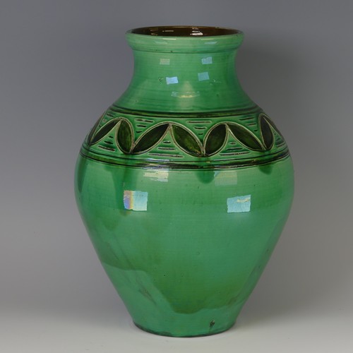 44 - William Fishley Holland (1888-1971) a large pottery Vase, of green ground with incised decoration, l... 