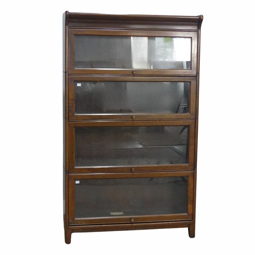 505 - An early 20th century mahogany four-tier Barristers Bookcase, having four glazed sliding doors, rais... 