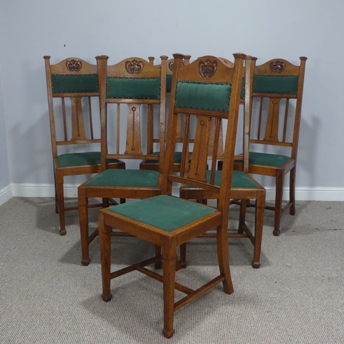 511 - A set of six oak Arts and Crafts dining Chairs, in the manner of Liberty, with carved and upholstere... 