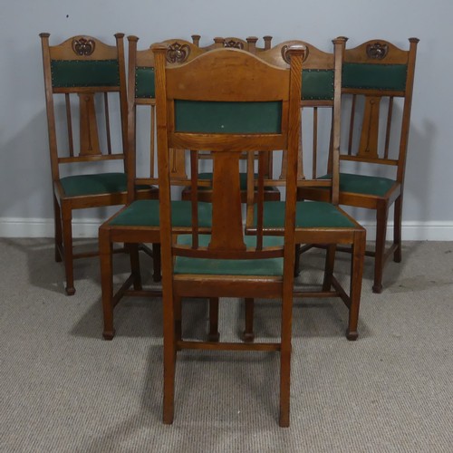 511 - A set of six oak Arts and Crafts dining Chairs, in the manner of Liberty, with carved and upholstere... 