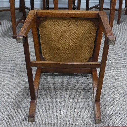 511 - A set of six oak Arts and Crafts dining Chairs, in the manner of Liberty, with carved and upholstere... 