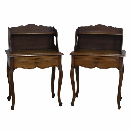 512 - A pair of 20th century French oak bedside Tables, with moulded top and shelves, over singular drawer... 