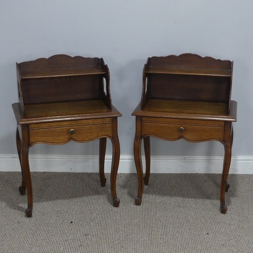 512 - A pair of 20th century French oak bedside Tables, with moulded top and shelves, over singular drawer... 