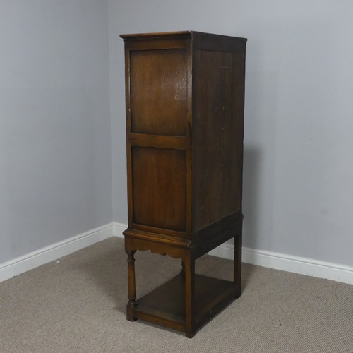 516 - A 20th century oak Art Nouveau inspired hall Cupboard, of small proportions, with panel doors, raise... 