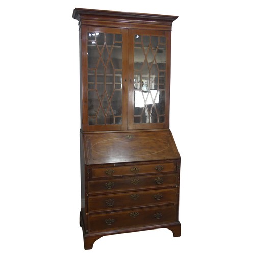 527 - A 19th century mahogany bureau Bookcase, moulded cornice over two astragal glazed doors, raised on b... 