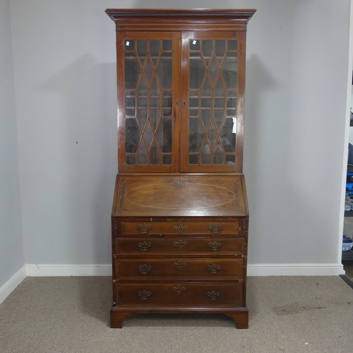 527 - A 19th century mahogany bureau Bookcase, moulded cornice over two astragal glazed doors, raised on b... 