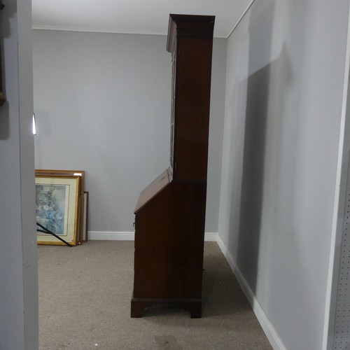 527 - A 19th century mahogany bureau Bookcase, moulded cornice over two astragal glazed doors, raised on b... 