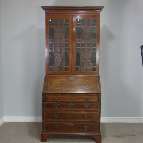 527 - A 19th century mahogany bureau Bookcase, moulded cornice over two astragal glazed doors, raised on b... 