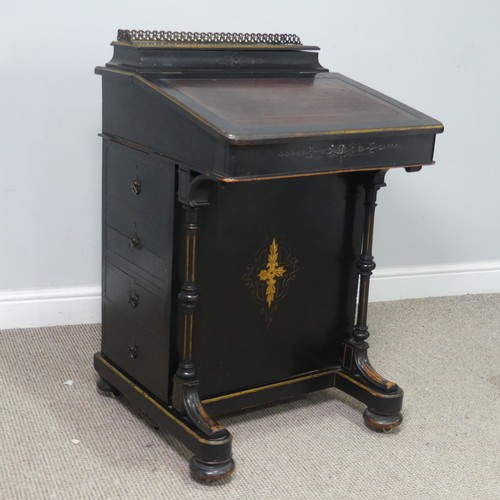 536 - An ebonised Victorian Davenport, the top with three quarter brass gallery and red painted writing su... 