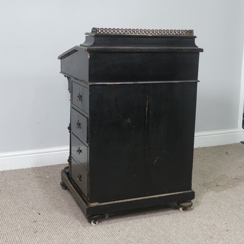 536 - An ebonised Victorian Davenport, the top with three quarter brass gallery and red painted writing su... 