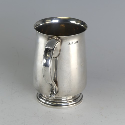 110 - An Elizabeth II silver Mug, by Elkington & Co Ltd., hallmarked Birmingham 1959, with scroll... 