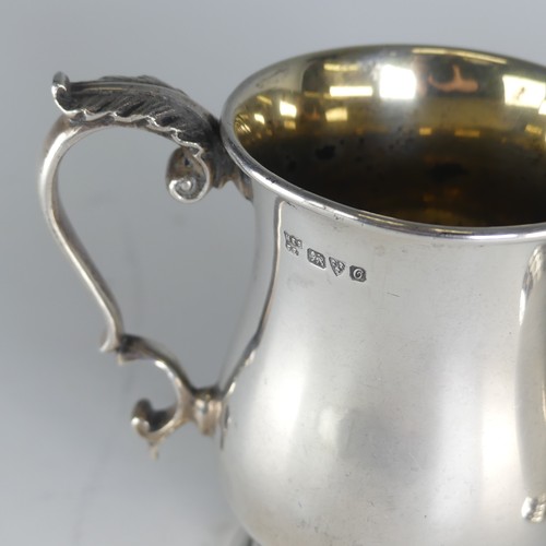 113 - A George V silver Mug, by Barker Brothers, hallmarked Chester 1914, 9cm high, with leaf capped ... 