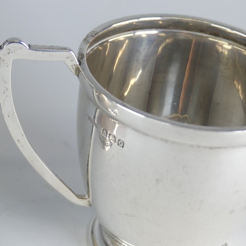 113 - A George V silver Mug, by Barker Brothers, hallmarked Chester 1914, 9cm high, with leaf capped ... 