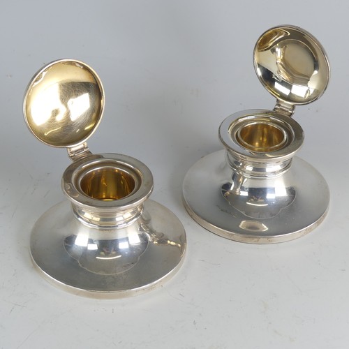 112 - A near pair of Elizabeth II silver capstan Inkwells, by W I Broadway & Co., hallmarked Birmingha... 