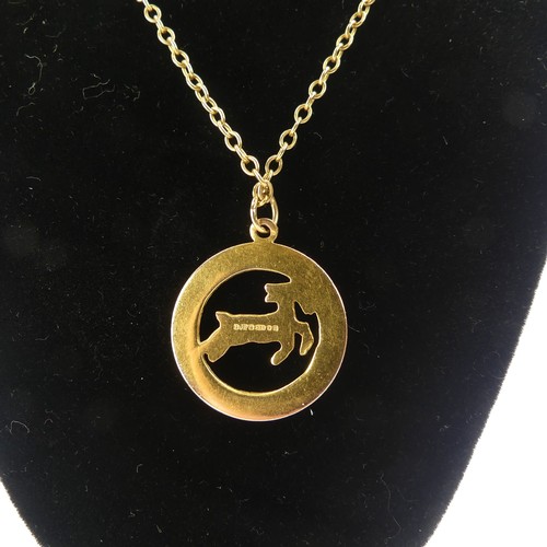 241 - A 9ct yellow gold 'Capricorn' Zodiac Pendant, 23.3mm diameter, on a 9ct gold oval link chain, 53cm l... 