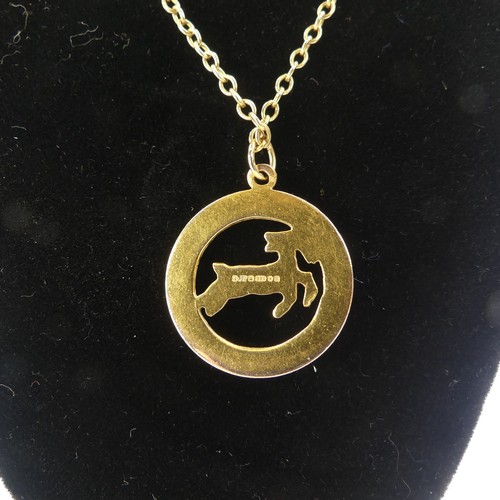 241 - A 9ct yellow gold 'Capricorn' Zodiac Pendant, 23.3mm diameter, on a 9ct gold oval link chain, 53cm l... 