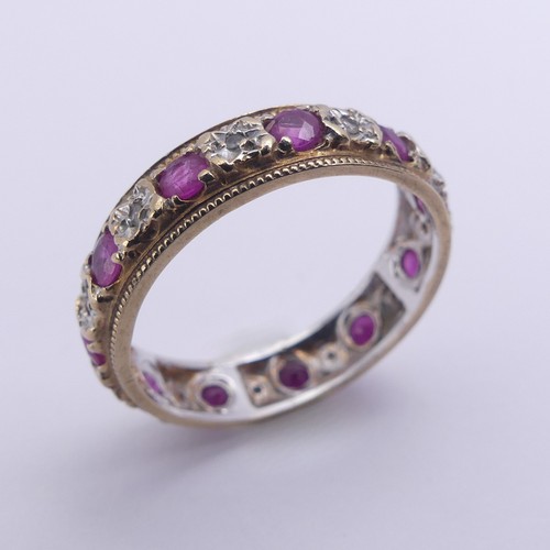 179 - A ruby and diamond full Eternity Ring, mounted in 9ct yellow and white gold, 4.75mm wide, Size N, ap... 