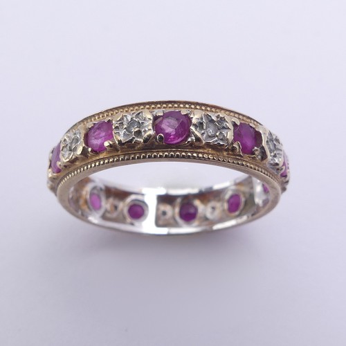 179 - A ruby and diamond full Eternity Ring, mounted in 9ct yellow and white gold, 4.75mm wide, Size N, ap... 