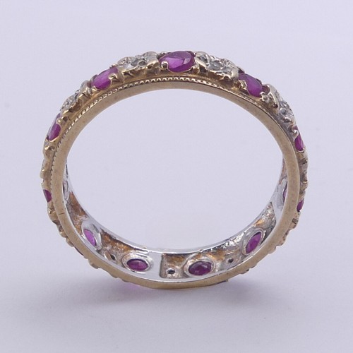 179 - A ruby and diamond full Eternity Ring, mounted in 9ct yellow and white gold, 4.75mm wide, Size N, ap... 