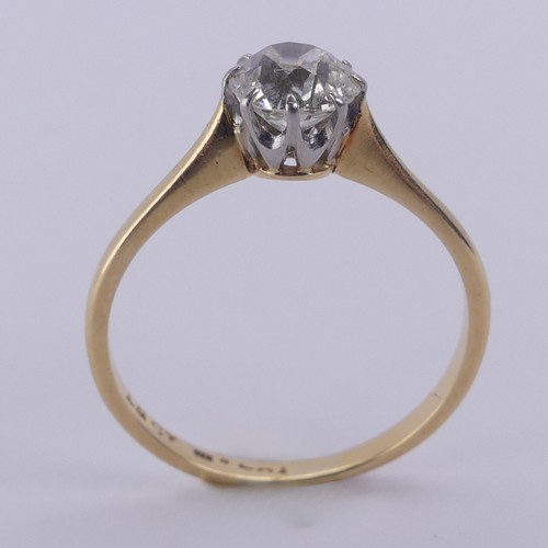 180 - A diamond solitaire Ring, the circular stone approx. 0.7ct, claw set in 18ct yellow gold and platinu... 