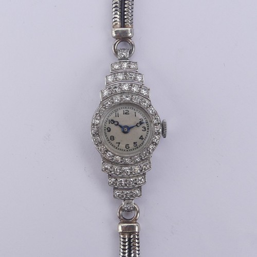 142 - A lady's Art Deco platinum and diamond Cocktail Watch, unsigned circular dial with Arabic Numerals, ... 