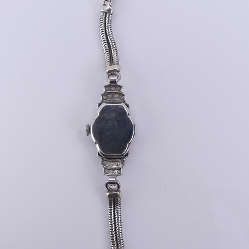 142 - A lady's Art Deco platinum and diamond Cocktail Watch, unsigned circular dial with Arabic Numerals, ... 