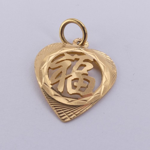 243 - A Chinese gold heart shaped Pendant, pierced with character marks, marked on the reverse, tested as ... 