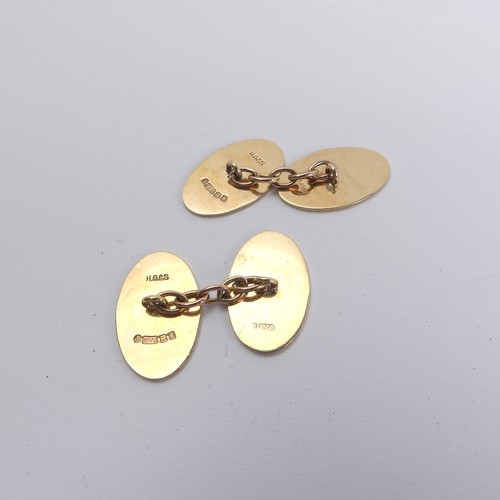 295 - A pair of 9ct yellow gold oval Cufflinks, the fronts with engraved starburst decoration, plain rever... 