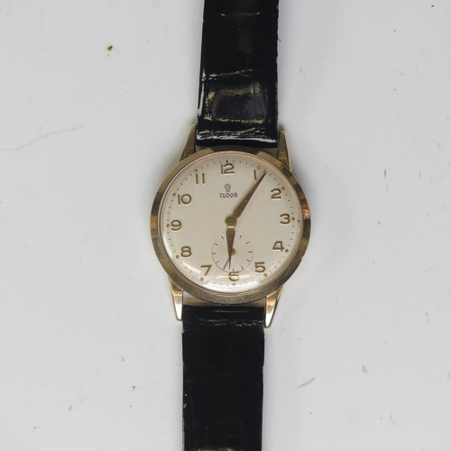 146 - A vintage 9ct gold Tudor Wristwatch, the signed silvered dial with gilt Arabic numerals and hands an... 