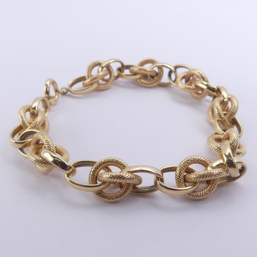 270 - An 18ct yellow gold Bracelet, with alternate textured and polished interlocking and circular links, ... 