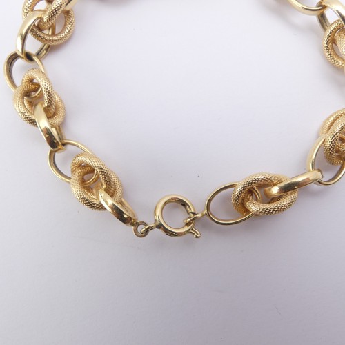 270 - An 18ct yellow gold Bracelet, with alternate textured and polished interlocking and circular links, ... 