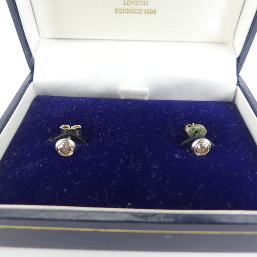 279 - A pair of diamond stud Earrings, the brilliant cut stones each approx. 0.25ct, collet set in 18ct wh... 