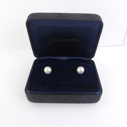 275 - Tiffany & Co.: A pair of cultured pearl Ear Studs, the circular pearls with pink hues approx. 8.... 