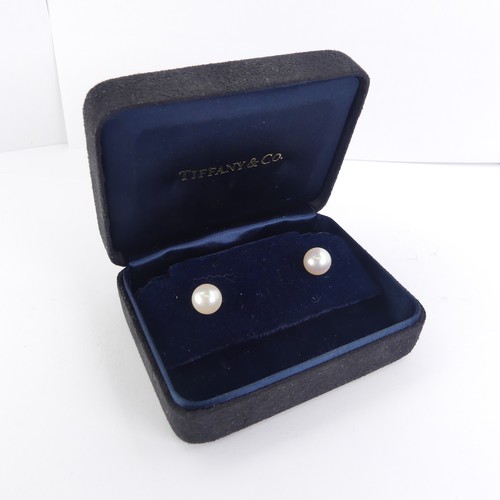 275 - Tiffany & Co.: A pair of cultured pearl Ear Studs, the circular pearls with pink hues approx. 8.... 