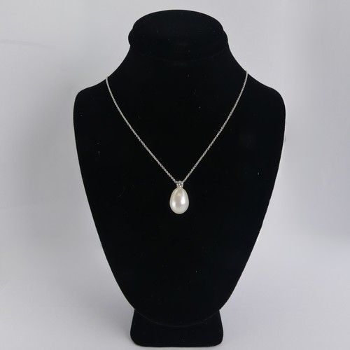 248 - A cultured pearl and diamond Pendant, the pear shaped pearl 14mm long, surmounted by a brilliant cut... 