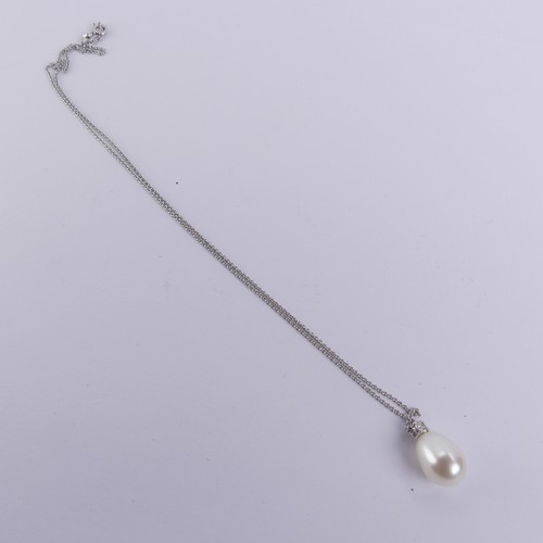 248 - A cultured pearl and diamond Pendant, the pear shaped pearl 14mm long, surmounted by a brilliant cut... 