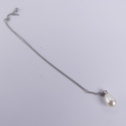 248 - A cultured pearl and diamond Pendant, the pear shaped pearl 14mm long, surmounted by a brilliant cut... 