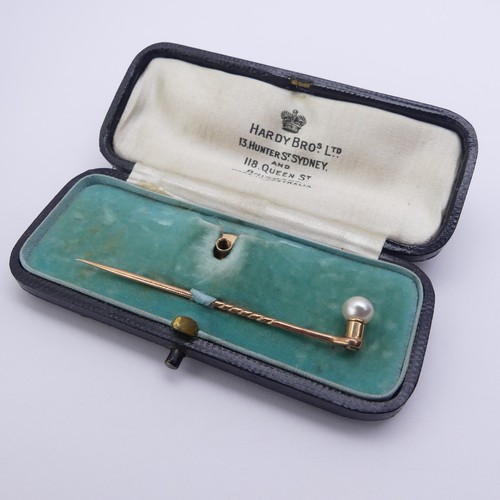 303 - A cased 15ct gold Stud / Stick Pin Set, with screw fitting cultured pearl finial, together with five... 