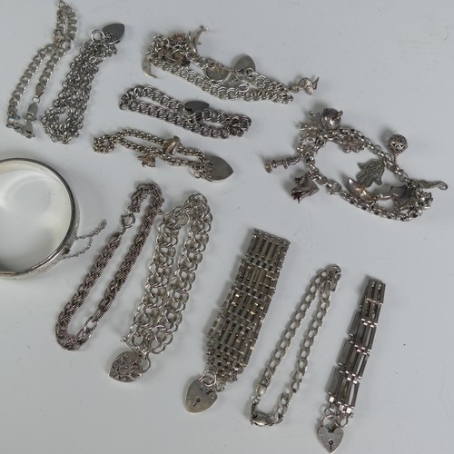 309 - Two silver Charm Bracelets, together with a silver hinged bangle and eleven other various silver bra... 