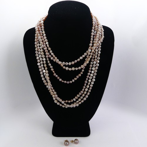 311 - A triple row of pink freshwater Pearls, with silver clasp, together with a pair of gold plate mounte... 