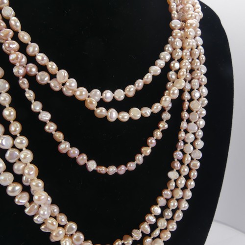 311 - A triple row of pink freshwater Pearls, with silver clasp, together with a pair of gold plate mounte... 